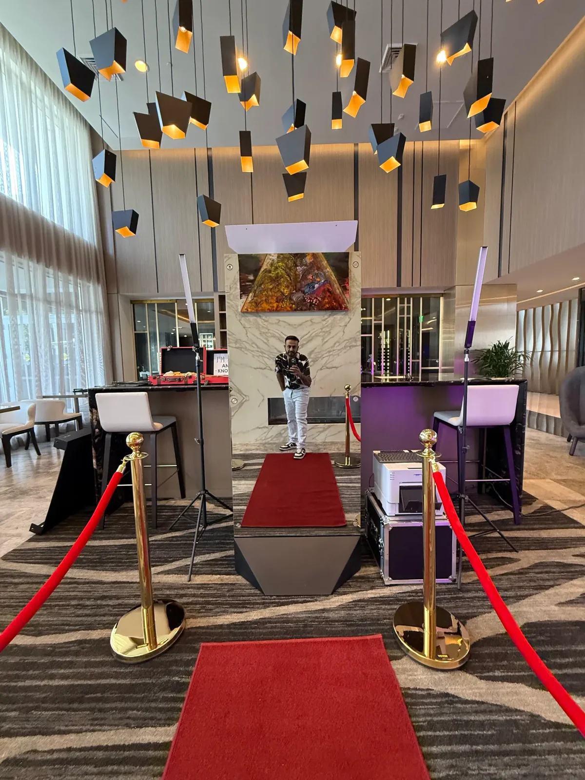 Full-height Magic Mirror booth and red carpet in a contemporary event venue